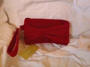 Marilyn! A festive red velvet holiday wristlet. It dresses up your little black dress. Priced at $35.