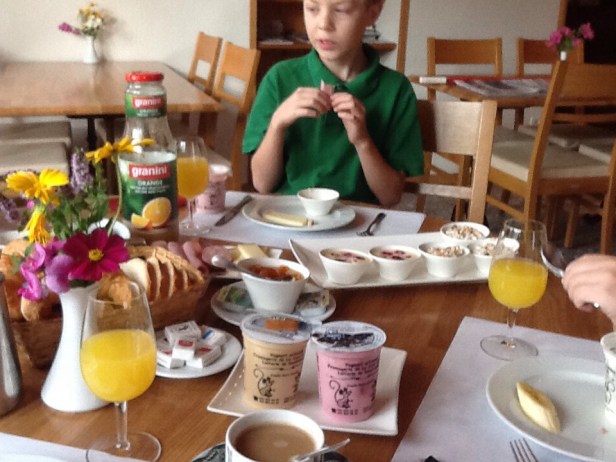 The breakfast that came with our room!  Yogurt produced right up the road! Creamcheese-like custard with fresh raspberries! Muesli! Honey sugar, also produced right up the road! Fresh sausage, smoked ham, and Gruyere cheese! OJ! Delicious Coffee with Steamed Milk! And BREAD! Croissants that would make you slap your mother! One of the best breakfasts I have ever had!  Mark, too.