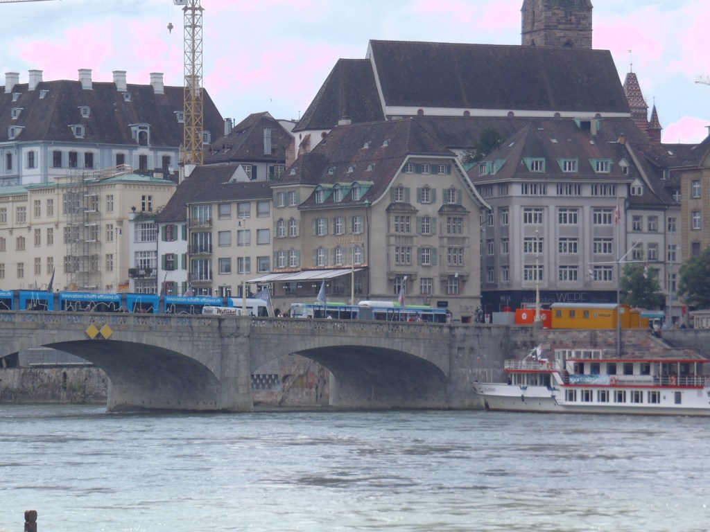 A closer view of the buildings behind the bridge.