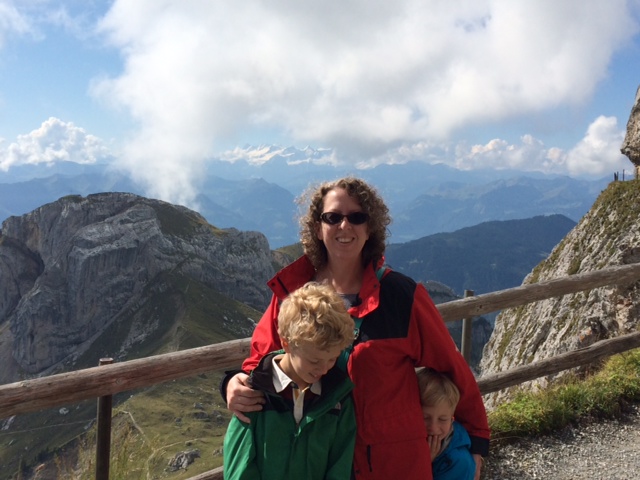 E and I on the trail. Note the snow capped Alps in the background.
