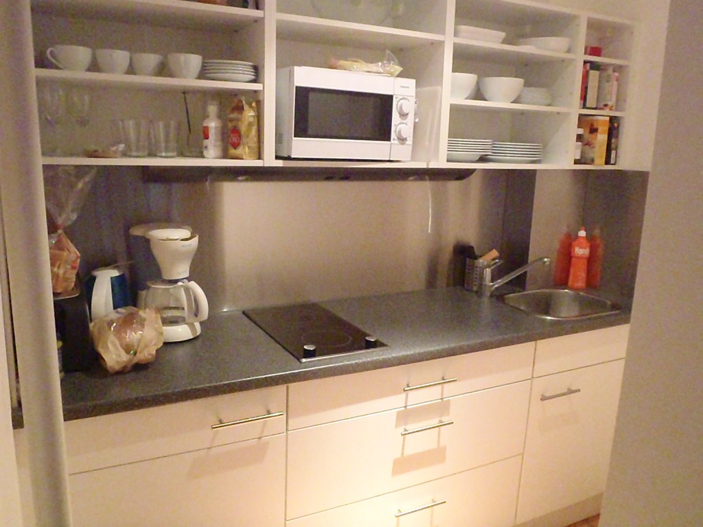 The entire kitchen.  There is room for one person. This does not stop the children from trying to join me.