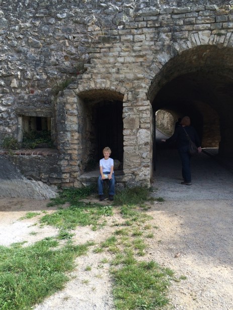 E in the footpath doorway of the castle.