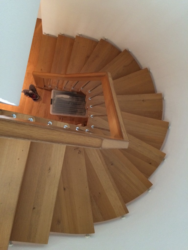 The stairs! They are a nice architectural feature and they don't require much space.