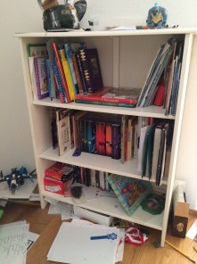 E's book area.  Loads more are up at his desk and the papers scattered around are different "project notes."  Embrace messes.